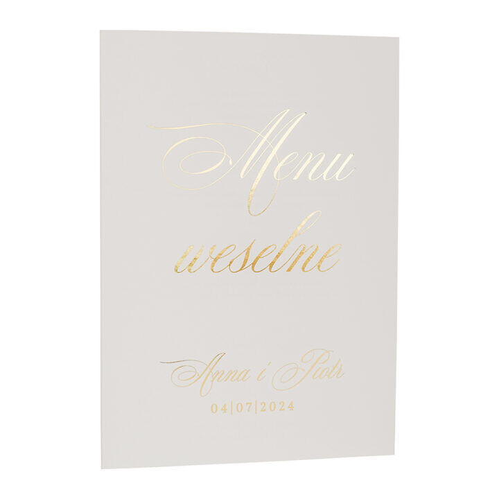 Menu złocone na białym papierze